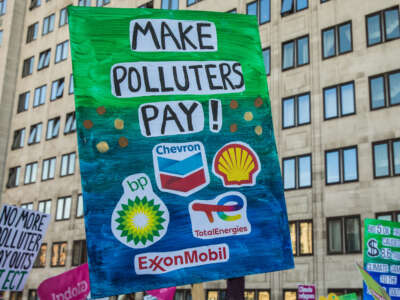 Climate justice campaigners march from the Shell Centre to Trafalgar Square to demand urgent climate finance and reparations for loss and damage for global south communities on November 12, 2022, in London, United Kingdom.