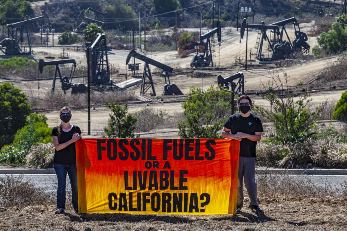 Activists gather near Inglewood Oil Field in Los Angeles, California, one of the largest contiguous urban oil fields in the country, to urge the Governor of California to take action to phase out fossil fuels, beginning with those within 2500 feet of homes and other sensitive sites.