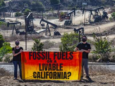 Activists gather near Inglewood Oil Field in Los Angeles, California, one of the largest contiguous urban oil fields in the country, to urge the Governor of California to take action to phase out fossil fuels, beginning with those within 2500 feet of homes and other sensitive sites.
