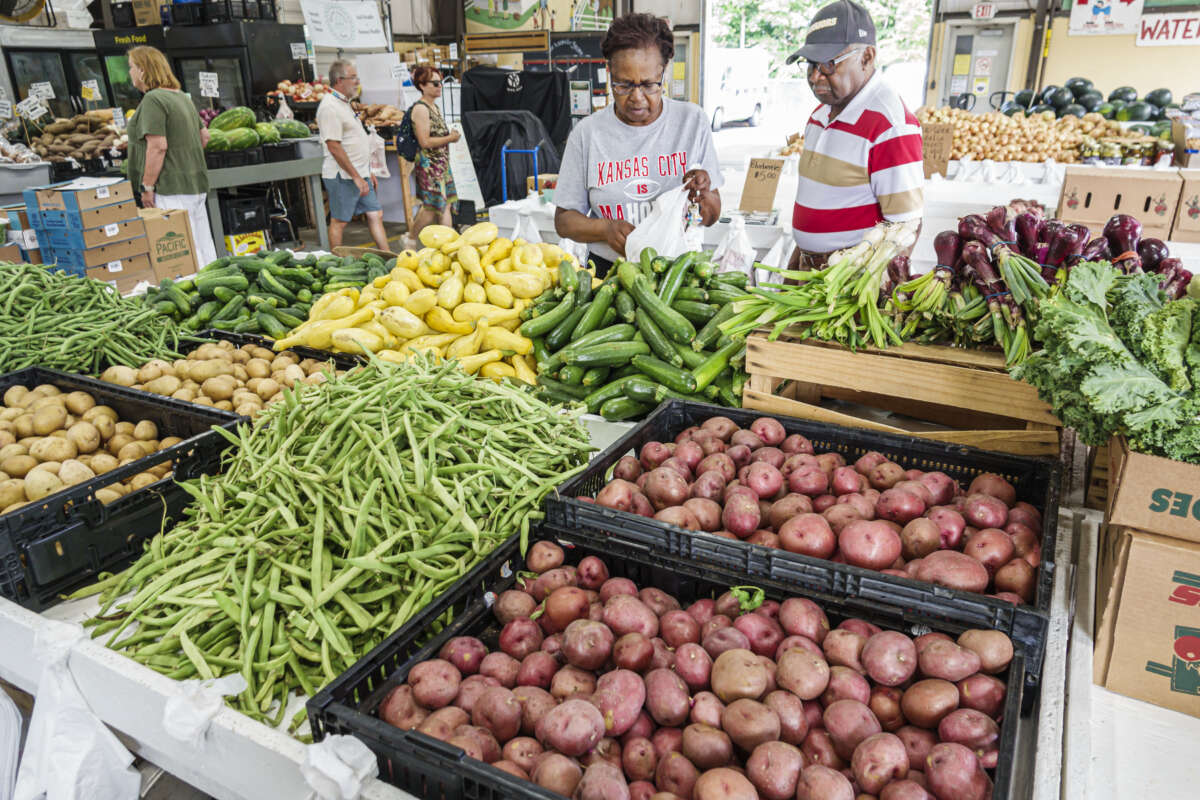 Red potatoes, green beans, and yellow squash are seen at the Charlotte Regional Farmers Market in Charlotte, North Carolina, on June 7, 2023.