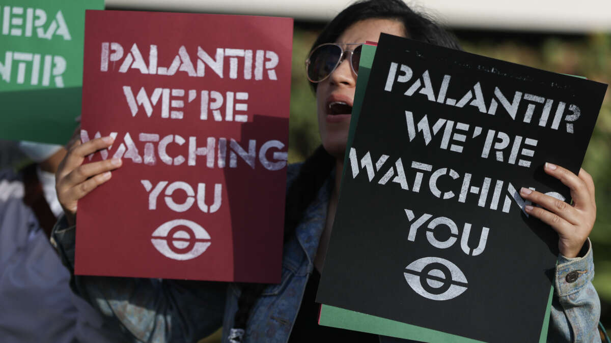 Protesters make themselves heard near Palantir’s new headquarters on March 3, 2026, in Aventura, Florida.
