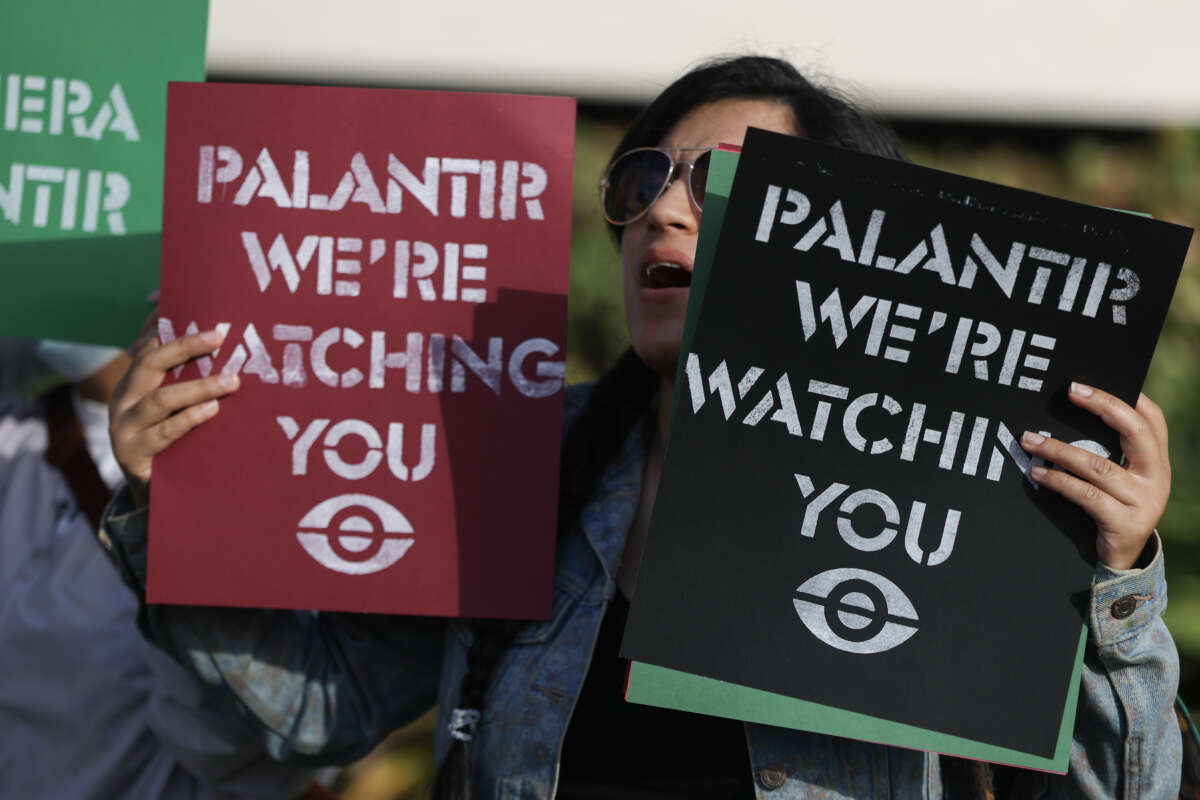 Protesters make themselves heard near Palantir’s new headquarters on March 3, 2026, in Aventura, Florida.