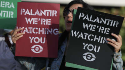 Protesters make themselves heard near Palantir’s new headquarters on March 3, 2026, in Aventura, Florida.