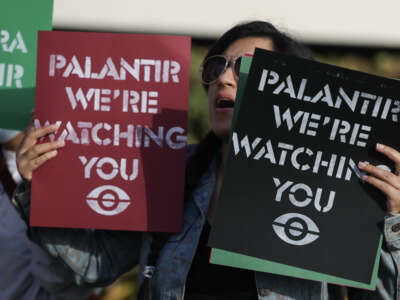 Protesters make themselves heard near Palantir’s new headquarters on March 3, 2026, in Aventura, Florida.