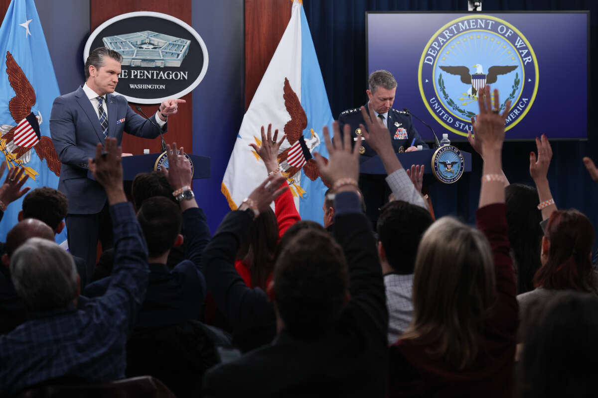 U.S. Secretary of Defense Pete Hegseth (L) calls on a reporter while answering questions with Chairman of the Joint Chiefs of Staff Air Force General Dan Caine (R) during a press briefing at the Pentagon on March 19, 2026, in Arlington, Virginia.