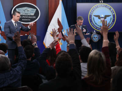 U.S. Secretary of Defense Pete Hegseth (L) calls on a reporter while answering questions with Chairman of the Joint Chiefs of Staff Air Force General Dan Caine (R) during a press briefing at the Pentagon on March 19, 2026, in Arlington, Virginia.