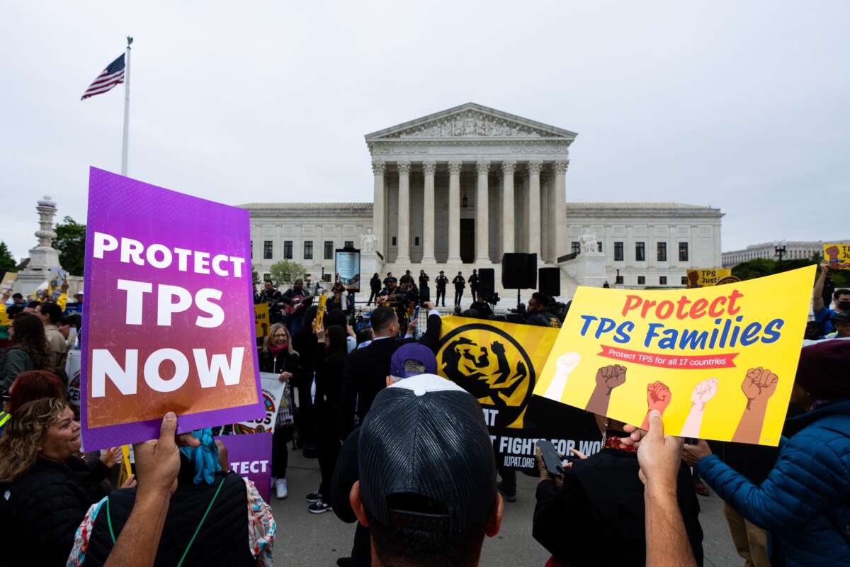 Temporary protected status holders along with union leaders and advocates rally as the Supreme Court prepares to hear oral arguments in Mullin v. Doe on April 29, 2026.