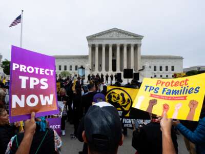 Temporary protected status holders along with union leaders and advocates rally as the Supreme Court prepares to hear oral arguments in Mullin v. Doe on April 29, 2026.