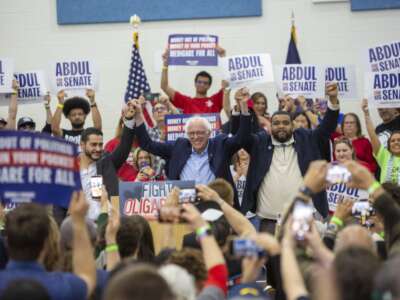 Senator Bernie Sanders held a rally at a Detroit high school as part of his 'Fighting Oligarchy' campaign. With Sanders are U.S. Senate candidate Dr. Abdul El-Sayed (left) and state representative Donavan McKinney, who is running for a Congressional seat.