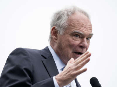 Senator Tim Kaine speaks during healthcare apparel company FIGS' "Healthcare is Human" rally on Capitol Hill in Washington, D.C., on May 21, 2026.