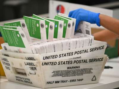 An election worker processes mail-in ballots at the Los Angeles County Ballot Processing Center during California's state primary election in the City of Industry, California, on June 2, 2026.