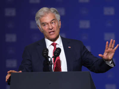 Administrator for the Centers for Medicare and Medicaid Services Dr. Mehmet Oz speaks ahead of Vice President JD Vance at the 128th Air Refueling Wing Hangar on July 8, 2026, in Milwaukee, Wisconsin.