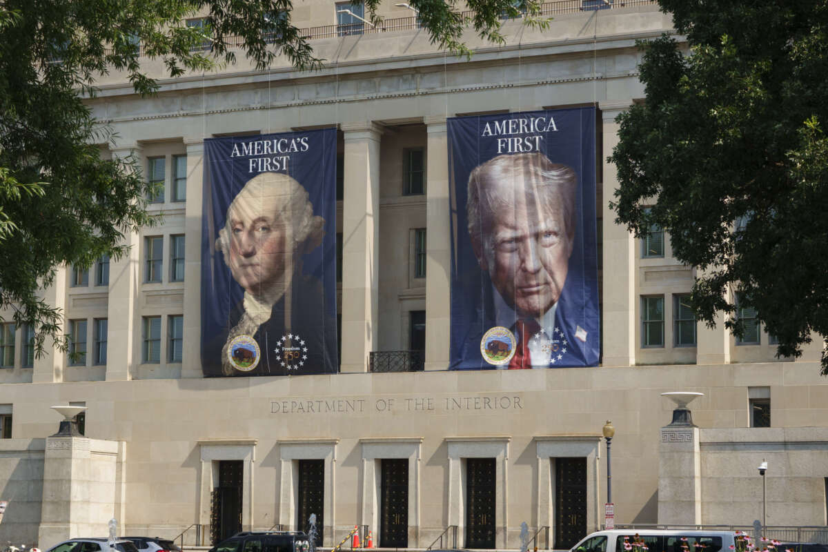 Banners with portraits of U.S. President George Washington and Donald Trump are displayed on the Stewart Lee Udall Department of the Interior Building on July 15, 2026, in Washington, D.C.