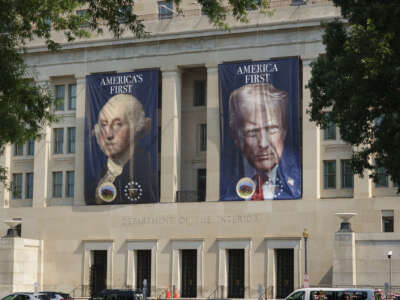 Banners with portraits of U.S. President George Washington and Donald Trump are displayed on the Stewart Lee Udall Department of the Interior Building on July 15, 2026, in Washington, D.C.