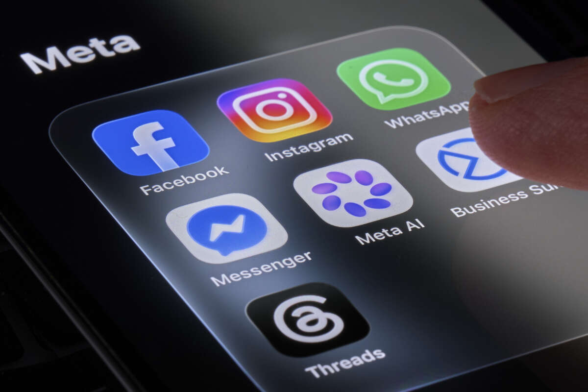 A person's finger touches the Meta folder containing the Facebook, Instagram, WhatsApp, Messenger, Meta AI, Business Suite and Threads apps displayed on a smartphone screen in this photo illustration taken on July 10, 2026, in Italy.