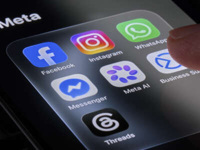 A person's finger touches the Meta folder containing the Facebook, Instagram, WhatsApp, Messenger, Meta AI, Business Suite and Threads apps displayed on a smartphone screen in this photo illustration taken on July 10, 2026, in Italy.