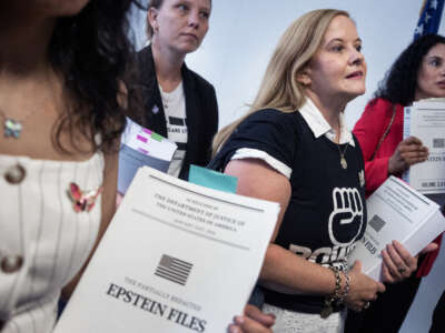 Jeffrey Epstein survivors including Sharlene Rochard, right, and Liz Stein, second from right, attempt to hand a copy of the Epstein files to Sen. John Cornyn, in Hart building on Wednesday, July 29, 2026, in Washington, D.C. Cornyn was talking with reporters about a canceled meeting with Acting Attorney General Todd Blanche, nominee for attorney general.