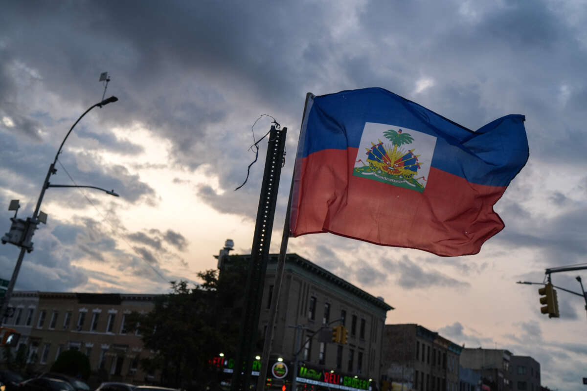 A Haitian flag is is seen flying in the Little Haiti neighborhood of Brooklyn, New York, on July 29, 2026. Tens of thousands of Haitians faced the prospect of leaving the United States or being deported, with the special protected status allowing them to live and work legally in the country expiring on August 3, 2026.