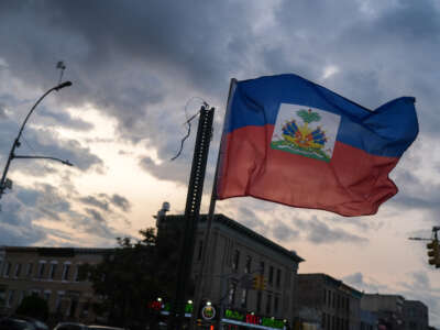 A Haitian flag is is seen flying in the Little Haiti neighborhood of Brooklyn, New York, on July 29, 2026. Tens of thousands of Haitians faced the prospect of leaving the United States or being deported, with the special protected status allowing them to live and work legally in the country expiring on August 3, 2026.