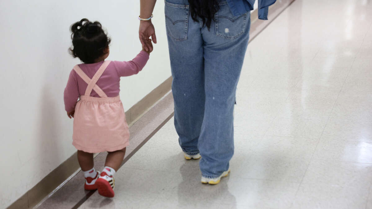Children wait outside of an immigration court at the Jacob K. Javits Federal Building on July 31, 2026, in New York City.