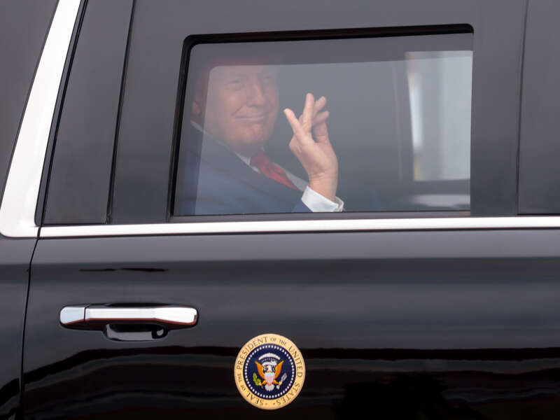 President Donald Trump waves from his limo as he arrives for the 2026 Patriot Games at SPIRE Academy on August 11, 2026, in Geneva, Ohio.
