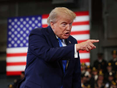 U.S. President Donald Trump arrives to deliver remarks at the David S. Mack Center for Training and Intelligence on August 14, 2026, in Garden City, New York.
