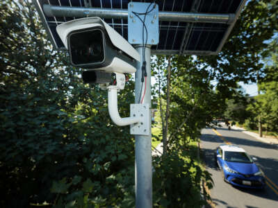 An automatic license plate reader (ALPR) camera monitors traffic at the intersection of Flower and Houston avenues on August 19, 2026 in Silver Spring, Maryland.