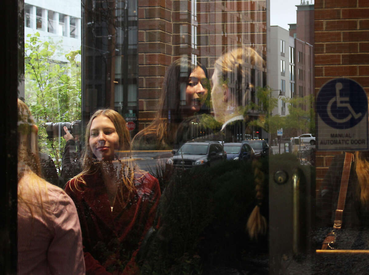 Eva Lighthiser, left, and other plaintiffs wait to enter Missoula’s federal courthouse on Sept. 16, 2025.