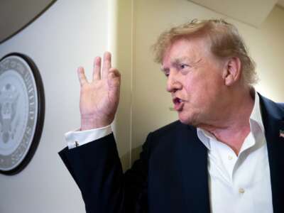 U.S. President Donald Trump speaks to the press aboard Air Force One while flying to Joint Base Andrews, Maryland from Ireland on September 13, 2026.
