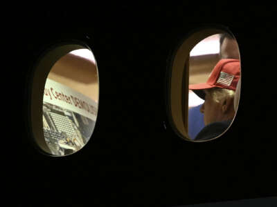 U.S. President Donald Trump is seen aboard Air Force One checking a Kennedy Center large printout after landing at Joint Base Andrews, Maryland on September 16, 2026.