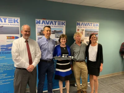 Martin Kao, second from left, with Susan Collins, center, at a publicity event at Navatek’s Maine headquarters in August 2019.