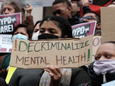 Opponents of New York Mayor Eric Adam's plan to involuntarily send unhoused people with mental illness to psychiatric hospitals participate in a rally at New York City Hall on December 8, 2022.