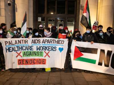 Health Workers for a Free Palestine picket military intelligence company Palantir on December 21, 2023 in London, England.