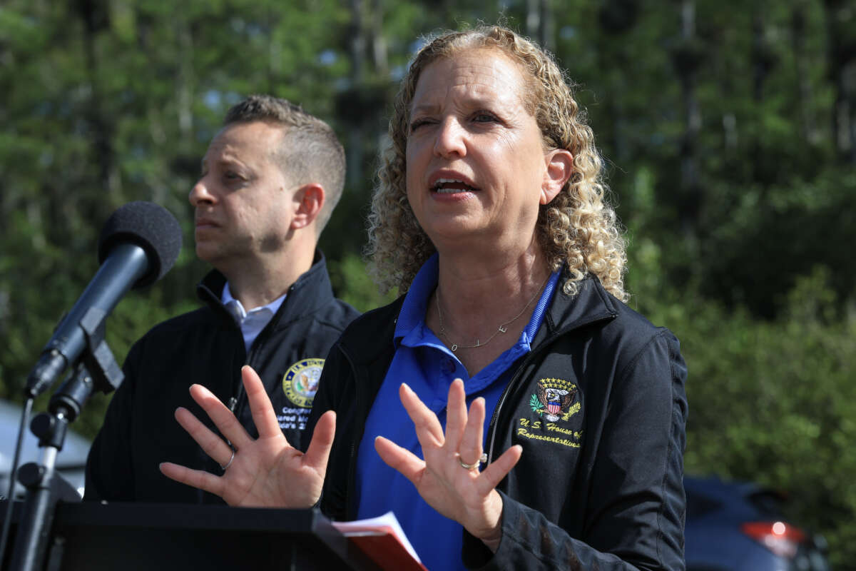 Rep. Jared Moskowitz and Rep. Debbie Wasserman Schultz speak to the media before a visit to "Alligator Alcatraz" at the Dade-Collier Training and Transition Airport on July 12, 2025, in Ochopee, Florida.