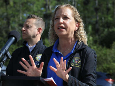 Rep. Jared Moskowitz and Rep. Debbie Wasserman Schultz speak to the media before a visit to "Alligator Alcatraz" at the Dade-Collier Training and Transition Airport on July 12, 2025, in Ochopee, Florida.