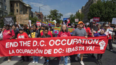 Thousands gather at Malcolm X Park and march to Freedom Plaza during the "We Are All DC" protest to demand the removal of President Donald Trump and an end to the federalization of the District of Columbia.