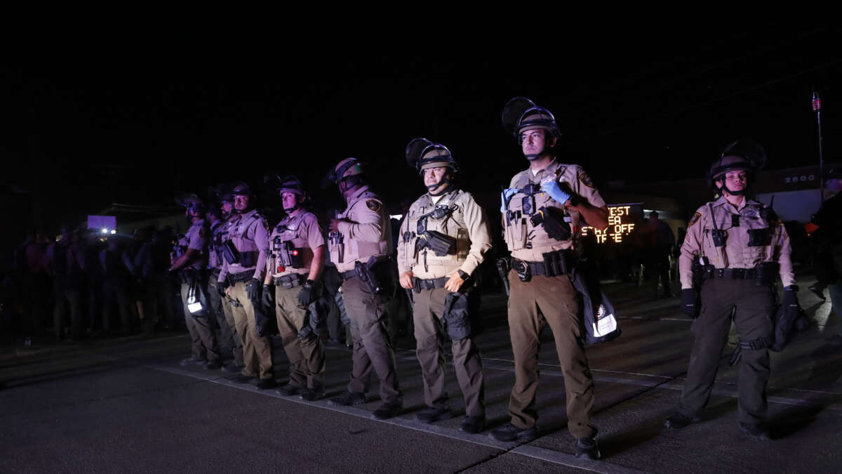 Illinois State Police stand guard while monitoring protesters gathering near an Immigration and Customs Enforcement facility in Broadview, Illinois, on October 4, 2025.