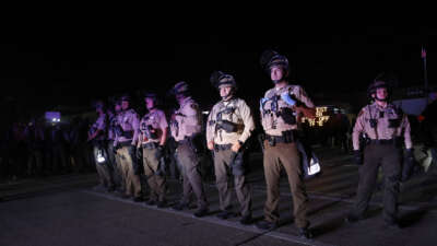 Illinois State Police stand guard while monitoring protesters gathering near an Immigration and Customs Enforcement facility in Broadview, Illinois, on October 4, 2025.