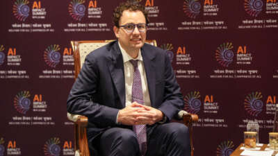 Anthropic CEO Dario Amodei looks on during a meeting with France's President Emmanuel Macron on the sidelines of the AI Impact Summit in New Delhi, India, on February 19, 2026.