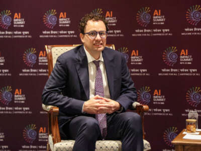 Anthropic CEO Dario Amodei looks on during a meeting with France's President Emmanuel Macron on the sidelines of the AI Impact Summit in New Delhi, India, on February 19, 2026.