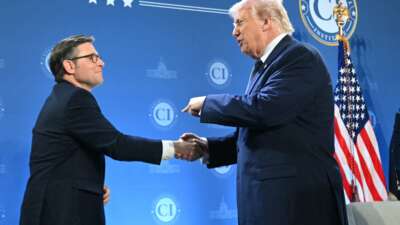 President Donald Trump shakes hands with the Speaker of the House Mike Johnson during the Republican Members Issues Conference at Trump National Doral in Miami, Florida, on March 9, 2026.