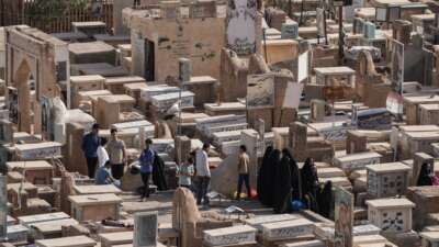Iraqis visit the graves of their loved ones on the first day of Eid al-Adha, the Feast of Sacrifice, in Iraq's holy city of Najaf on May 27, 2026.
