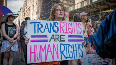A protestor holds a sign defending trans rights. Thousands of New Yorkers took to the streets of Manhattan to participate in the annual Reclaim Pride Queer Liberation March, where no police, politicians or corporations were allowed to participate.