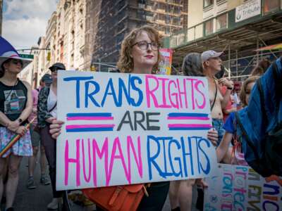 A protestor holds a sign defending trans rights. Thousands of New Yorkers took to the streets of Manhattan to participate in the annual Reclaim Pride Queer Liberation March, where no police, politicians or corporations were allowed to participate.