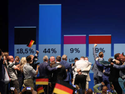 Supporters of the far-right Alternative for Germany (AfD) cheer at the AfD election evening watch party as initial results show the party with 44 percent in Saxony-Anhalt state elections on September 6, 2026, in Magdeburg, Germany.