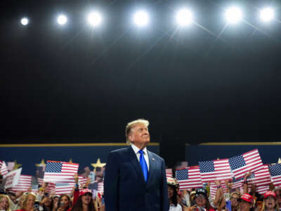 U.S. President Donald Trump walks on stage to speak on the first day of the 2026 Republican National Convention at the American Airlines Center on September 9, 2026, in Dallas, Texas.