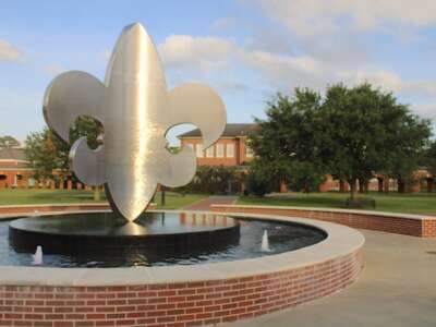 A fleur de lis sculpture is the centerpiece of the quadrangle fountain at the University of Louisiana at Lafayette.