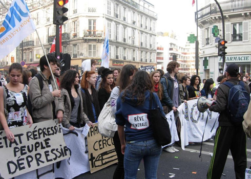 Members of a national union of high school students. One sign reads : 