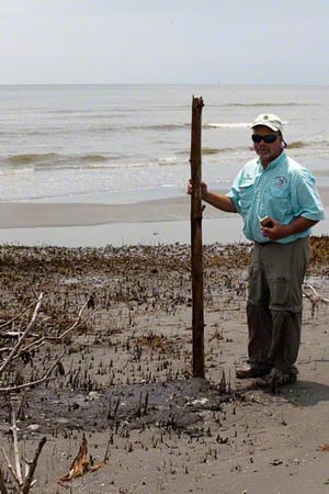 Charter fisherman Craig Matherne with tar mat, West Timbalier Isle, Louisiana, August 16, 2010.