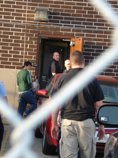An undocumented immigrant is taken inside the Broadview Detention Center.